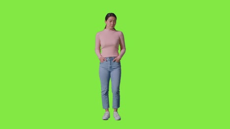 Full-Length-Studio-Portrait-Of-Confident-Independent-Woman-Standing-Against-Green-Screen-1